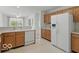 Bright kitchen featuring white appliances and wood cabinets with lots of counter space at 1108 Nanwich Ct, Indianapolis, IN 46217