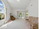 Bright living room with high ceilings, large windows, and access to the outdoor patio at 1108 Nanwich Ct, Indianapolis, IN 46217