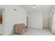 Cozy living room with neutral carpet and a large sliding door to a screened porch at 1108 Nanwich Ct, Indianapolis, IN 46217