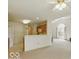 Open-concept living area with a kitchen and lots of natural light from the large window at 1108 Nanwich Ct, Indianapolis, IN 46217