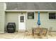 Inviting backyard patio area perfect for outdoor dining with grill and umbrella, located near back door at 1114 Pennsylvania St, Columbus, IN 47201