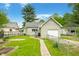 Spacious backyard with a patio, detached garage, and well-maintained landscaping at 1114 Pennsylvania St, Columbus, IN 47201