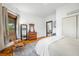 Cozy bedroom with a vintage rocking chair, dresser, and doorway to other rooms at 1114 Pennsylvania St, Columbus, IN 47201