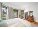 Bright bedroom with a large bay window and antique wood furniture at 1114 Pennsylvania St, Columbus, IN 47201