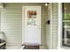 Charming front door with glass accents, complemented by stylish fixtures and a welcoming 'Home' doormat at 1114 Pennsylvania St, Columbus, IN 47201