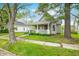 Charming home with a covered front porch and well-maintained lawn, perfect for relaxing outdoors at 1114 Pennsylvania St, Columbus, IN 47201