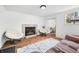 Bright living room featuring two papasan chairs, a fireplace, and a gray patterned rug at 1114 Pennsylvania St, Columbus, IN 47201