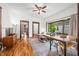 Cozy living room with hardwood floors, a ceiling fan, and a comfortable couch, ideal for relaxation at 1114 Pennsylvania St, Columbus, IN 47201