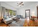 Inviting living room features a comfortable sofa, natural light from a large window, and hardwood floors at 1114 Pennsylvania St, Columbus, IN 47201