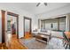 Comfortable living room with hardwood floors, a sectional couch, and a window view, perfect for everyday living at 1114 Pennsylvania St, Columbus, IN 47201