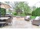 Relaxing outdoor patio with comfortable seating, a fire pit, and lush green surroundings, ideal for entertaining at 11233 Rockingham Cir, Fishers, IN 46037