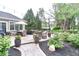 Outdoor patio featuring comfortable seating, hot tub, dining area, and lush landscaping, perfect for relaxation at 11233 Rockingham Cir, Fishers, IN 46037