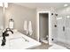 Modern bathroom featuring a glass enclosed shower and a double sink vanity with white countertops at 11233 Rockingham Cir, Fishers, IN 46037
