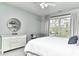 Airy bedroom featuring a large window, dresser, and side chair at 11233 Rockingham Cir, Fishers, IN 46037
