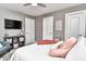 Inviting bedroom featuring a cozy chair, soft rug, ceiling fan and warm accents at 11233 Rockingham Cir, Fishers, IN 46037