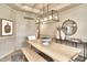Well-lit dining room with a modern chandelier, light wood table, and stylish decor at 11233 Rockingham Cir, Fishers, IN 46037