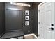 A welcoming entryway featuring a built-in mudroom bench and storage, perfect for organization at 11233 Rockingham Cir, Fishers, IN 46037