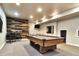 Basement game room with a pool table, high-top table and chairs, and a modern design at 11233 Rockingham Cir, Fishers, IN 46037
