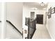 Bright upstairs hallway with dark trim and an armoire at the end at 11233 Rockingham Cir, Fishers, IN 46037