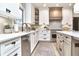 Modern kitchen featuring white cabinets, stainless steel appliances, and quartz countertops with tile backsplash at 11233 Rockingham Cir, Fishers, IN 46037
