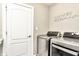 Efficient laundry room equipped with modern washer and dryer units at 11233 Rockingham Cir, Fishers, IN 46037
