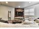 Cozy living room features a modern design with shiplap wall, large sofa, and natural lighting at 11233 Rockingham Cir, Fishers, IN 46037