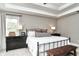 Cozy bedroom featuring a dark dresser, bench, and plenty of natural light at 11233 Rockingham Cir, Fishers, IN 46037