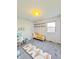 Staged bedroom with a minimalist theme, featuring a desk and shelves at 1205 N Gibson Ave, Indianapolis, IN 46219
