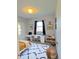 Bedroom featuring a desk, a cozy bed, and stylish decor at 1205 N Gibson Ave, Indianapolis, IN 46219