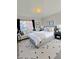 Staged bedroom with a large window and a comfortable seating area at 1205 N Gibson Ave, Indianapolis, IN 46219