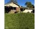 Charming single-story home with a well-maintained lawn and attached two car garage at 1205 N Gibson Ave, Indianapolis, IN 46219