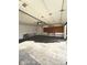 Empty garage with a concrete floor and peg board wall at 1205 N Gibson Ave, Indianapolis, IN 46219