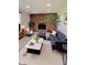 This living room boasts a brick fireplace, neutral decor, and modern furniture arrangement at 1205 N Gibson Ave, Indianapolis, IN 46219