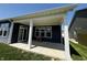 Covered back patio with white beams, offering an ideal outdoor living space with a view of the lush green lawn at 1221 Malbec Cir, Westfield, IN 46074