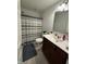 Clean bathroom features a vanity with plenty of storage and a shower with a striped curtain at 1221 Malbec Cir, Westfield, IN 46074