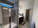 Bathroom with a glass-enclosed shower and double sink vanity, highlighted by neutral tile at 1221 Malbec Cir, Westfield, IN 46074