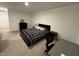 Inviting bedroom with a modern bed, desk, and plenty of space for relaxation or work at 1221 Malbec Cir, Westfield, IN 46074
