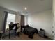 Bright bedroom features a desk area, gaming chair, and ample natural light at 1221 Malbec Cir, Westfield, IN 46074