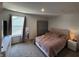 Bedroom features a plush bed, a large window with natural light, and modern decor at 1221 Malbec Cir, Westfield, IN 46074