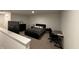 Well-lit bedroom with desk, TV, and simple decor for a comfortable living space at 1221 Malbec Cir, Westfield, IN 46074
