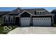 Charming home boasts a two-car garage and well-maintained landscaping, offering great curb appeal at 1221 Malbec Cir, Westfield, IN 46074
