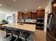 Modern kitchen with stainless steel appliances, granite countertops, a large island and wood cabinets at 1221 Malbec Cir, Westfield, IN 46074