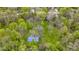 Aerial view of a lush wooded property with a basketball court and a home with a deck at 13 Ridgeline Dr, Brownsburg, IN 46112