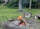Picturesque yard, featuring beautiful woods, and a stone fire pit area at 13 Ridgeline Dr, Brownsburg, IN 46112