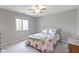 Bright bedroom featuring neutral paint, carpet, ceiling fan, and a window to enjoy the exterior view at 13 Ridgeline Dr, Brownsburg, IN 46112