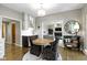 Cozy breakfast nook featuring a round table and decorative chairs with views of the living room at 13 Ridgeline Dr, Brownsburg, IN 46112