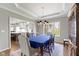 Spacious dining room with views into the kitchen, featuring white cabinets and stainless steel appliances at 13 Ridgeline Dr, Brownsburg, IN 46112
