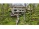 View of home showcasing multiple decks and levels surrounded by mature trees at 13 Ridgeline Dr, Brownsburg, IN 46112