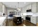 Bright kitchen with a large island, stainless steel appliances, and hardwood floors at 13 Ridgeline Dr, Brownsburg, IN 46112