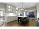 Modern kitchen featuring an island with seating, stainless steel appliances, and ample cabinet space at 13 Ridgeline Dr, Brownsburg, IN 46112